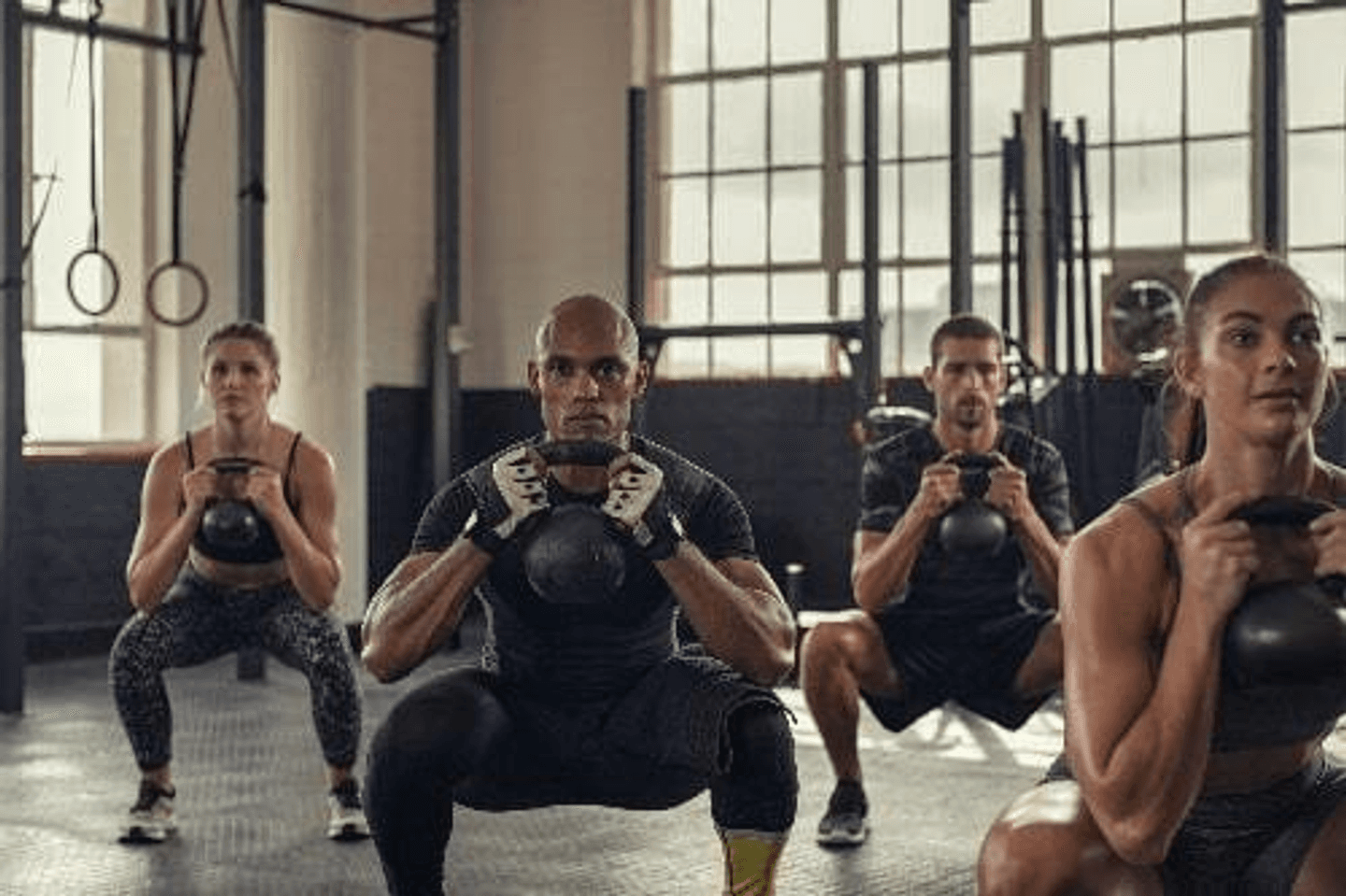 ISSA | Group Using Kettle Bells Stock Photo